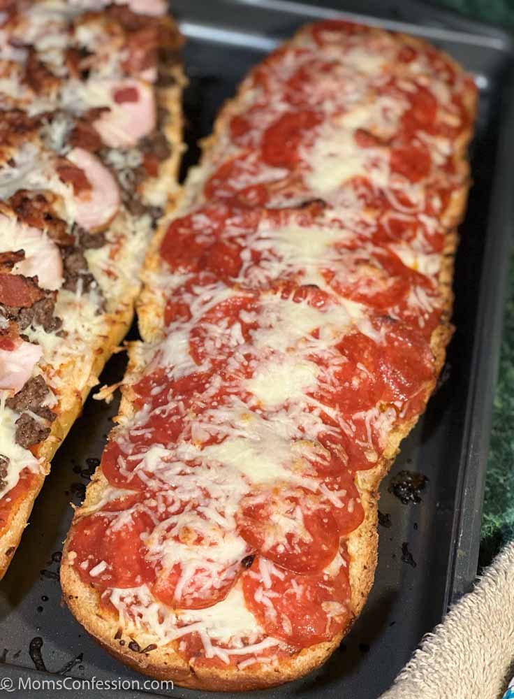pepperoni french bread pizza on a baking sheet