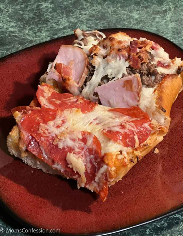 pepperoni french bread pizza and meat lovers french bread pizza on a red plate