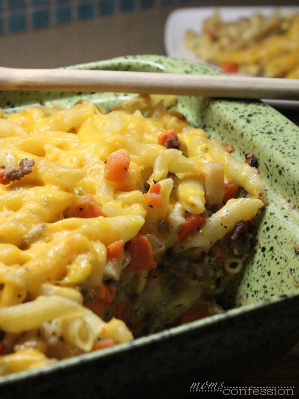 hamburger pasta recipe in a casserole dish with a spoon