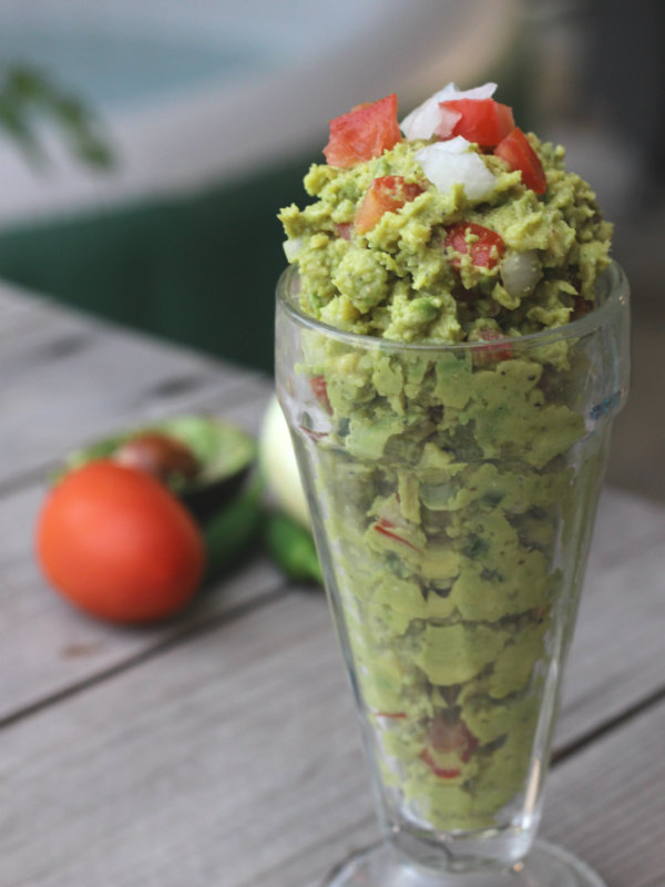 My mom has a way of making any Tex-Mex dish appealing and scrumptious, but this homemade guacamole recipe is perfect! I'd say it's the best damn guacamole.