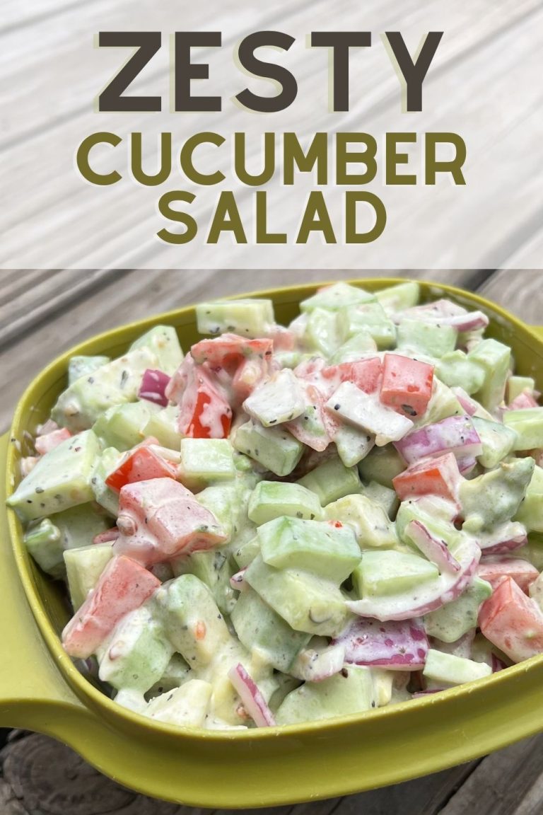 Zesty cucumber ranch salad with chopped cucumbers, tomatoes, red onion, and creamy ranch dressing served in a green bowl.