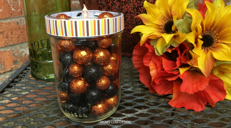This diy mason jar craft votive candle is the best craft idea for fall. Make this craft in less than 10 minutes and have the perfect centerpiece for fall.