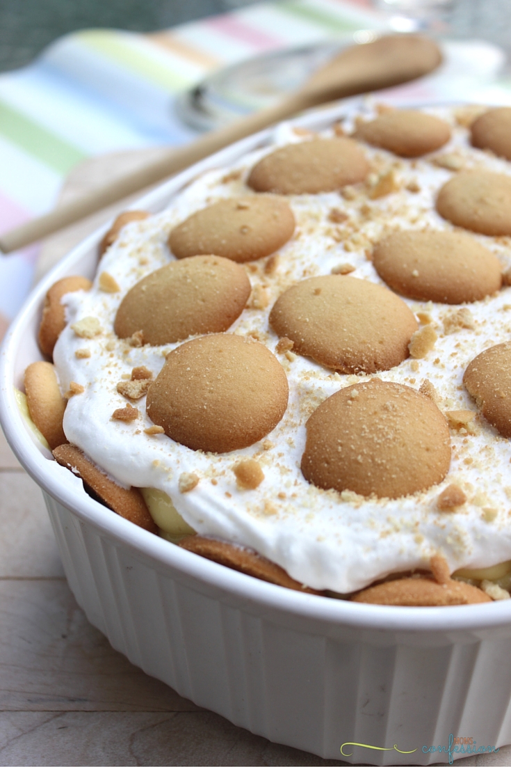 close up of banana pudding in a bowl on a cutting board