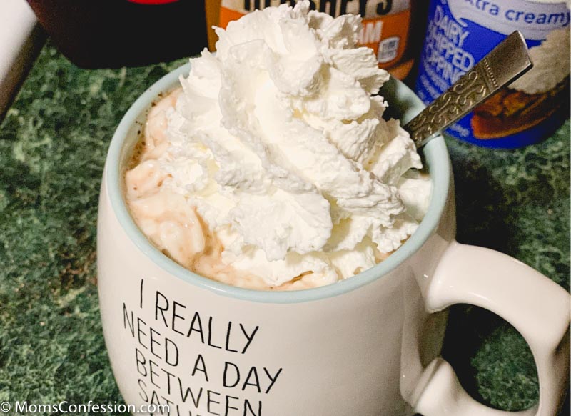 overhead photos of Chocolate Mocha Coffee Recipe ready to enjoy with chocolate and caramel syrup in the background