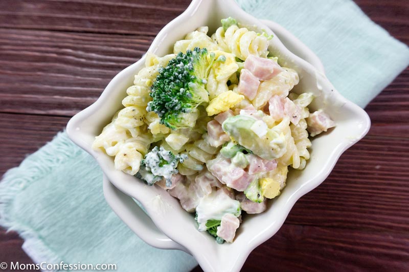 Closeup photo of Leftover Ham Pasta Recipe in a white square bowl on a table ready to eat