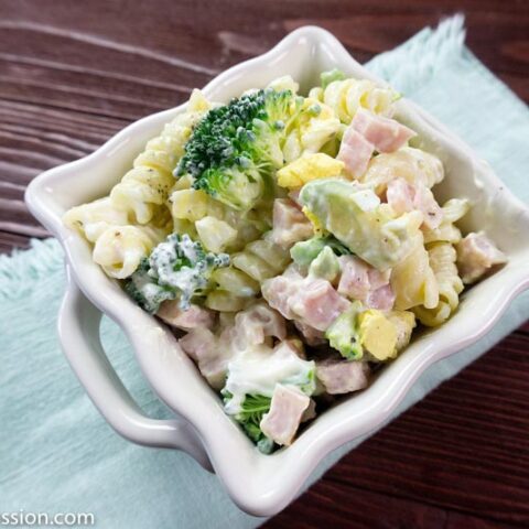 Angle photo of Leftover Ham Pasta Recipe in a white square bowl on a table ready to eat