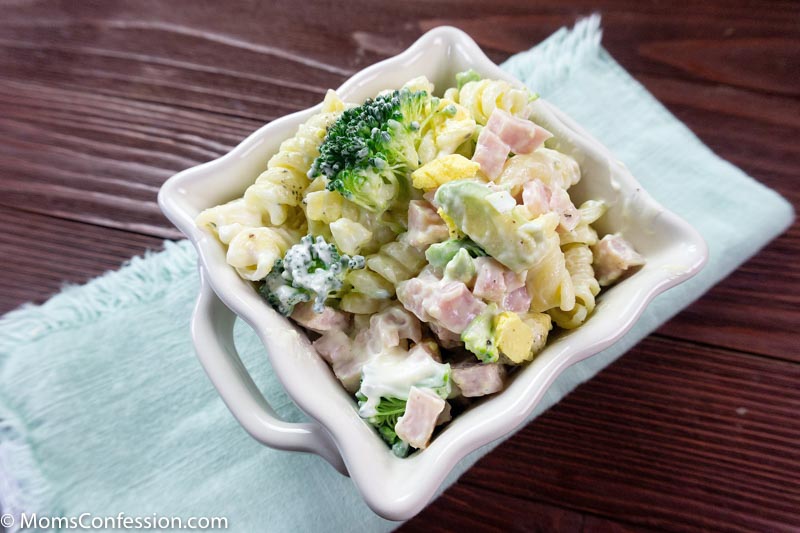 Angle photo of Leftover Ham Pasta Recipe in a white square bowl on a table ready to eat