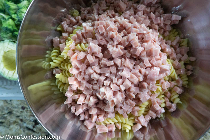 pasta and ham in a large mixing bowl