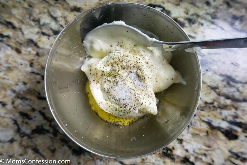 mayo, mustard, salt and pepper in a small bowl ready to be mixed together