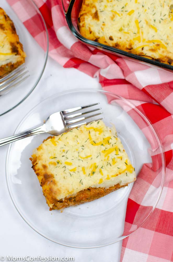 portrait overhead image of Easy shepherds pie recipe on a clear plate with a fork