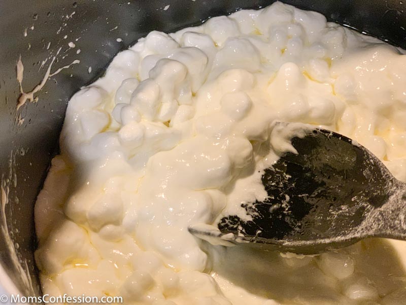 melting mini marshmallows on the stove in a saucepan