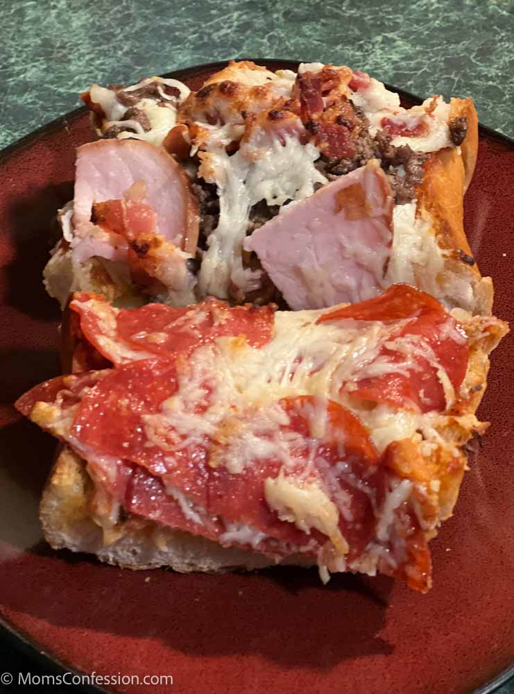 pepperoni french bread pizza and meat lovers french bread pizza on a red plate